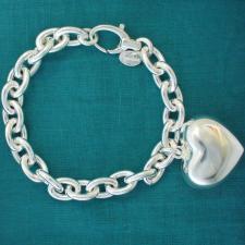 Sterling silver heart charm bracelet.