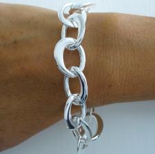 Bracciale artigianale argento 925 maglie ovali battute asimmetriche. Larghezza 17mm.