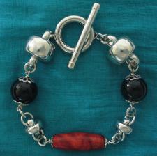 Sterling silver bracelet with black onyx & natural madrepore.