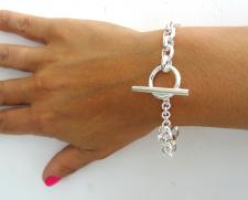 Bracciale a catena ovale e chiusura a barretta
