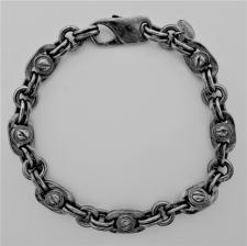 Silver bracelet with screws.