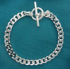 Sterling silver solid diamond cut curb bracelet 7mm x 2,7mm. Toggle bracelet.