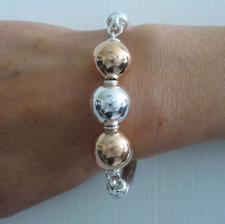 Sterling silver semi bangle bracelet with 18kt rose gold plating balls 16mm.