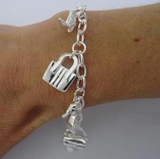 Silver bag and shoe charm bracelet.