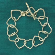 Solid sterling silver heart link bracelet 20mm. T-bar closure.