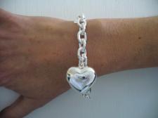 Sterling silver heart charm bracelet.