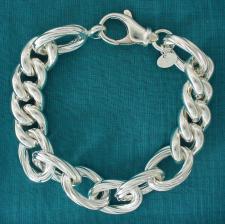 Sterling silver textured oval link bracelet. Curb link 13mm. Hollow link.