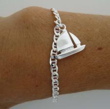 Silver bracelet with sailboat charm