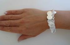 Silver bracelet with coin charms