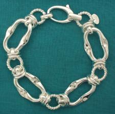 Sterling silver handmade bracelet. Asymmetrical link 17x27mm and textured links.