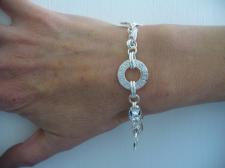 Sterling silver bracelet with Greek textured link.