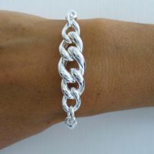 Sterling silver semi-bangle bracelet with curb link.