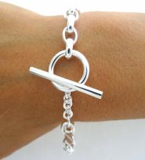 Bracciale a catena ovale e chiusura a barretta