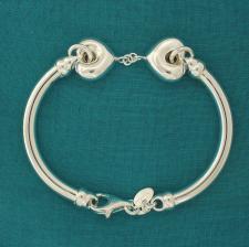 Sterling silver bangle bracelet with hearts.