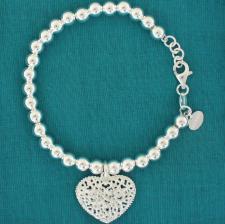 Bracciale argento palline 6mm con cuore traforato.