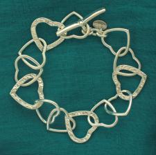 Solid sterling silver textured heart link bracelet 20mm. T-bar closure.