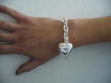 Sterling silver heart charm bracelet.