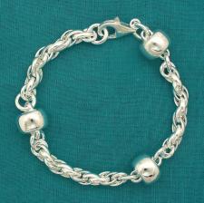 Bracciale in argento 925, maglie ovali intrecciate e barilotti 12mm.