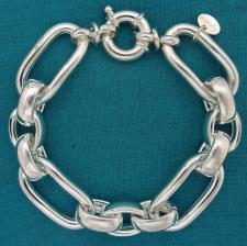 Sterling silver fancy oval rolo link bracelet.