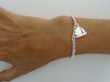 Silver bracelet with sailboat charm