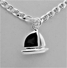 Silver bracelet with sailboat charm