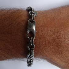 Silver bracelet with screws.