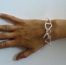 Bracciale in argento 925 con cuori incatenati godronati - donna