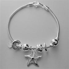 Bracciale in argento 925 charms scorrevoli. Fantasia stella marina, nodi e sfere.