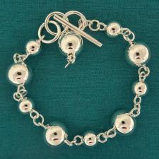 Bracciale palline argento 8-12mm ''Catena Parigina alternata''. Chiusura T-bar.