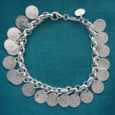 Sterling silver charms bracelet, Half Dollar.