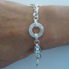 Sterling silver bracelet with Greek textured link.